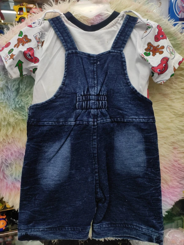 cute baby denim dungaree shorts set featuring a dark wash finish with elastic gathering at the back and a playful printed t-shirt underneath
