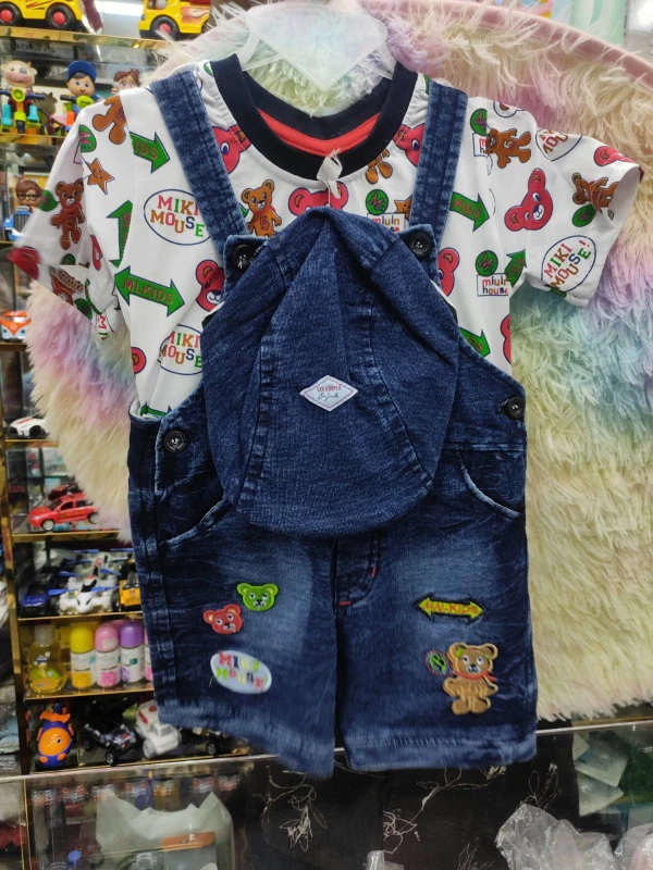 cute baby's denim dungaree short set paired with a colorful cartoon-print t-shirt adorned with playful bear and Mickey patches