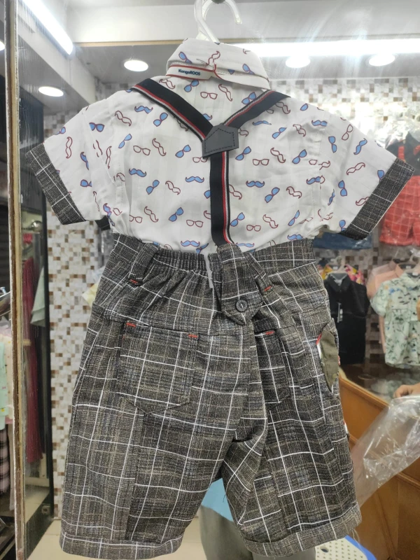 baby boy's gentleman outfit featuring a white short-sleeve shirt with a playful glasses and mustache print, paired with gray plaid shorts and attached suspenders